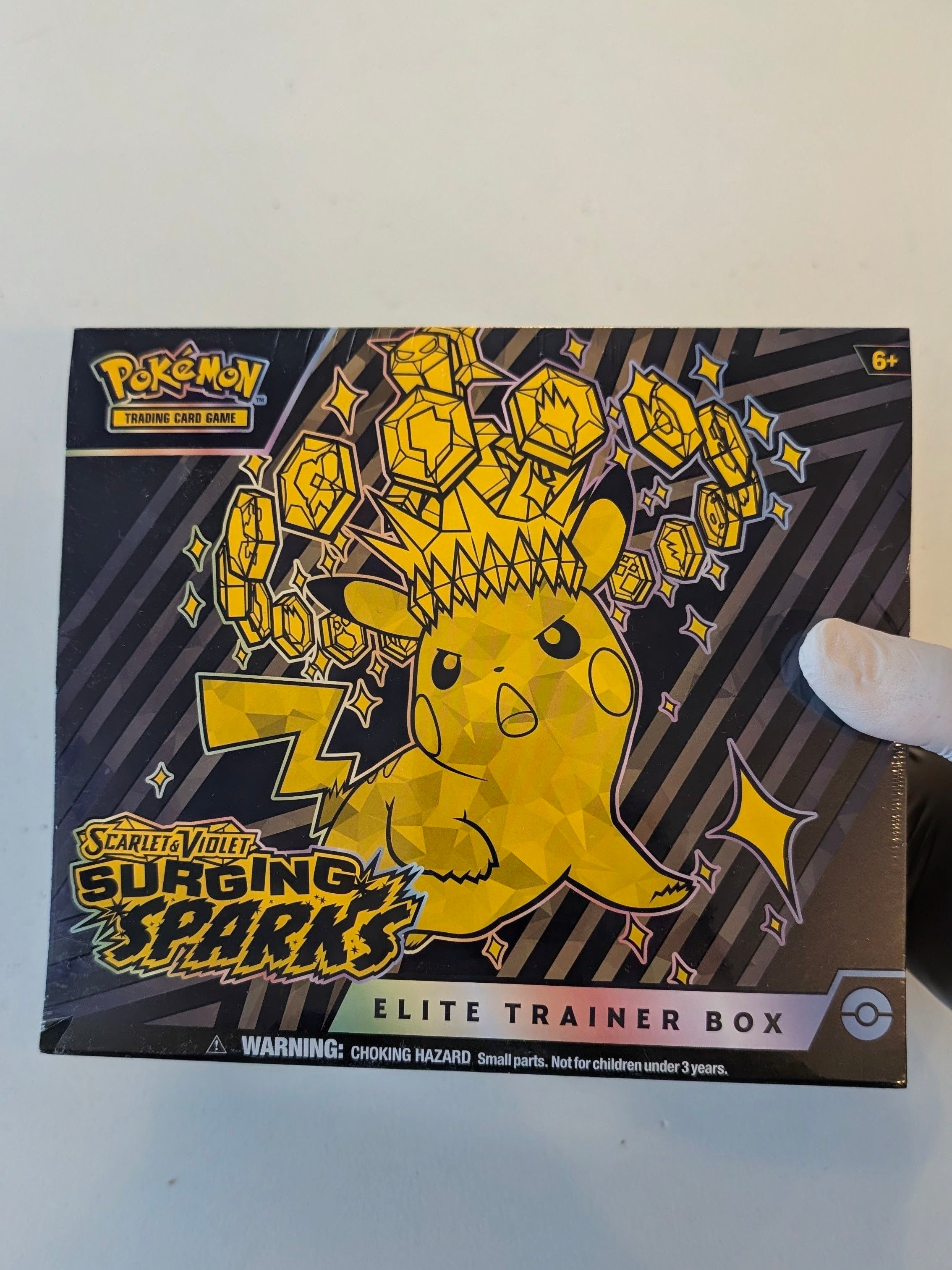 Surging Sparks Elite Trainer Box - SV08: Surging Sparks (SSP) w/ Minor Tear