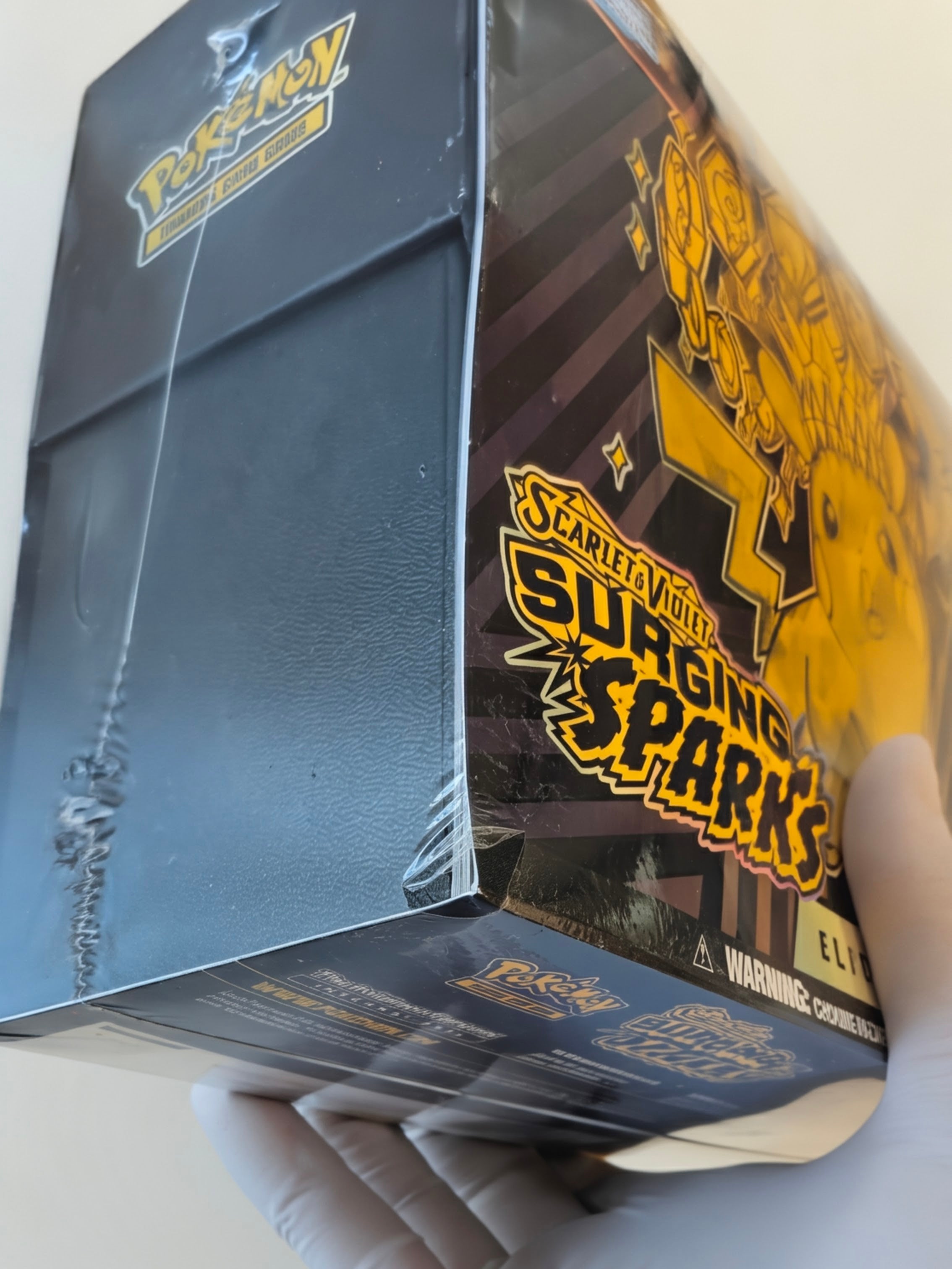 Surging Sparks Elite Trainer Box - SV08: Surging Sparks (SSP) w/ Minor Tear